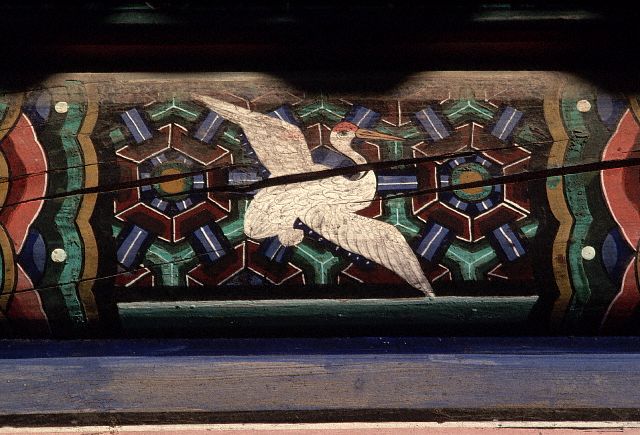 A painting of a stork in flight embellishes a wooden pillar in the Pulguk-sa Temple, South Korea