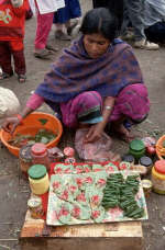 A woman prepares betel nuts