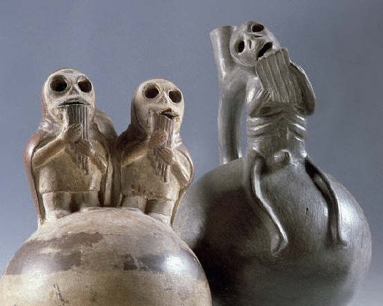 Two Mochica Stirrup-Spouted Jars Depicting Skeletal Figures Playing Andean Pipes
