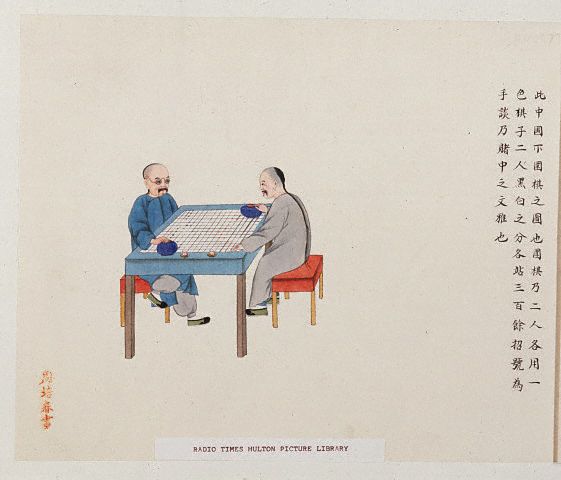 Chinese man playing a board game