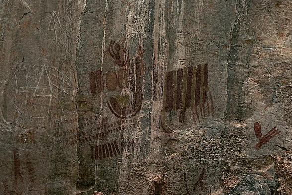 Rock Paintings of a Falling Figure and Symbols at the Shelter of Desinhos in Januaria, Brazil