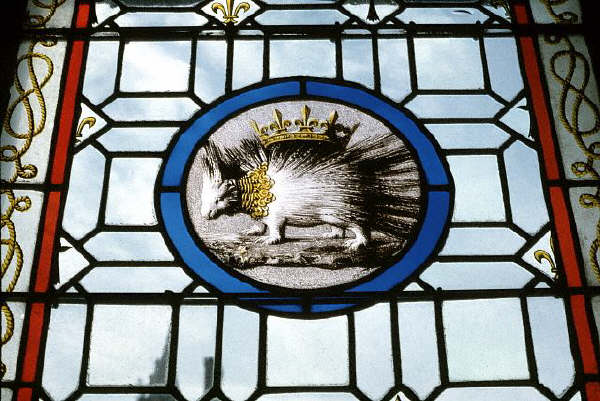 The porcupine, the crest of the Louis XII, King of France, on a stained glass window at a chateau at Blois, France