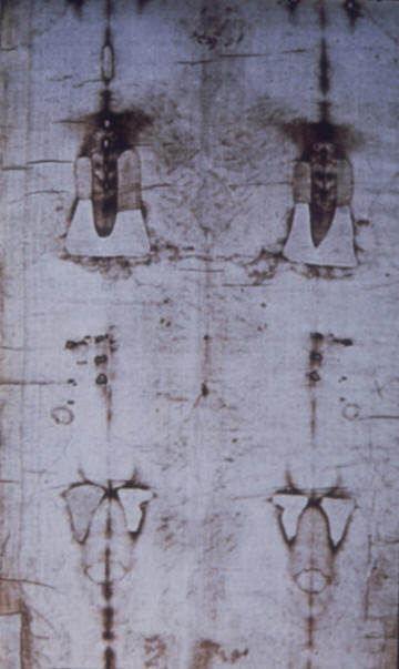 Holy shroud,  Image is seen between scorches and patches from 1532 fire