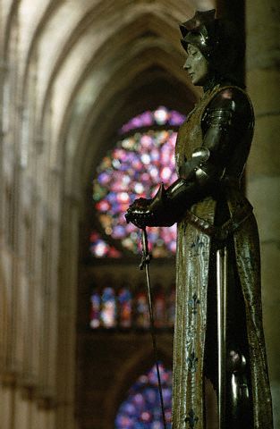 A statue of Joan of Arc stands in the Reims Cathedral, France