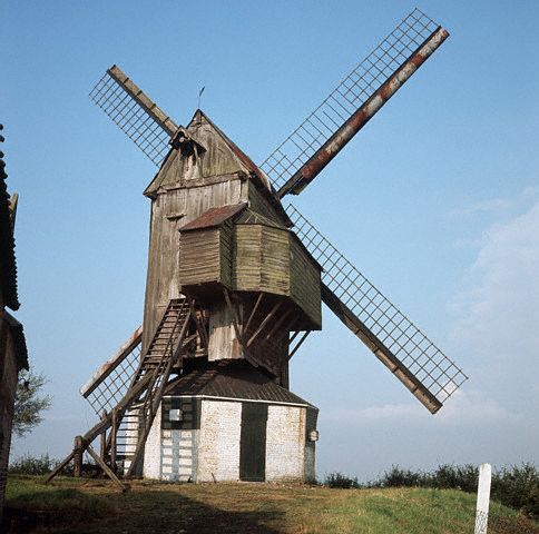 A traditional wooden windmill in the old town of Esquelbecq, part of Flemish France