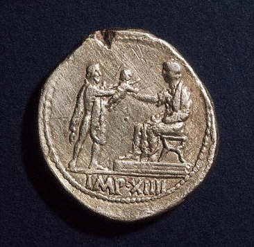 Coin Depicting Barbarian Holding Out a Child to Augustus