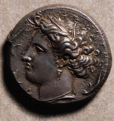Ancient Greek Silver Coin With Profile Portrait of a Woman