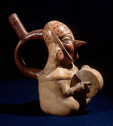 Mochica Stirrup Spout Bottle in the Form of a Man With a Pointed Nose Playing a Drum ca.300 AD