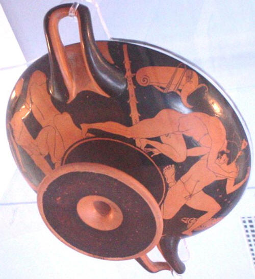 A red-figure cup showing wrestlers