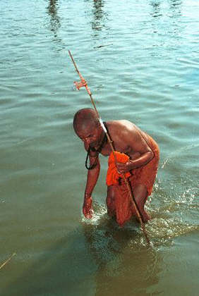 An ascetic, or Sadhu, washes in the sacred river