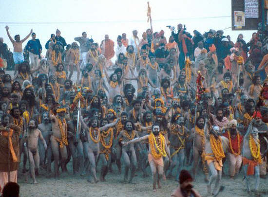 Naga sadhus or naked holy men runing to take their ritual bath