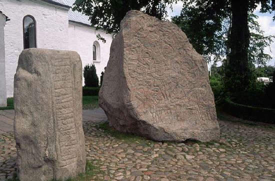 Two royal runic gravestones, dating from the 10th century, in a graveyard in Jutland