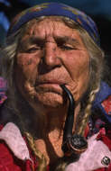 Elderly Gypsy Woman Smoking Pipe