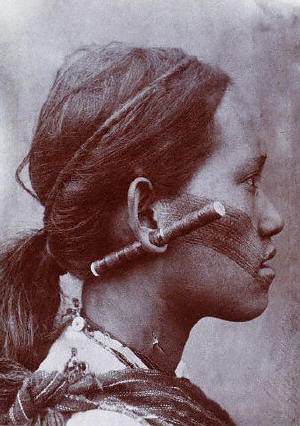 A Chinese woman with a tattooed face