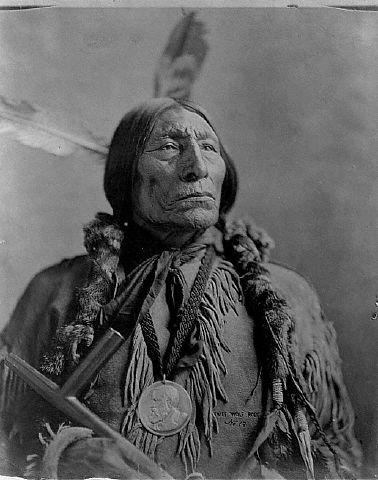 Chief Wolf Robe with a peace pipe, 1904