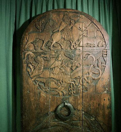 The upper roundel of a carved wooden church door from the Valthyofsstadir