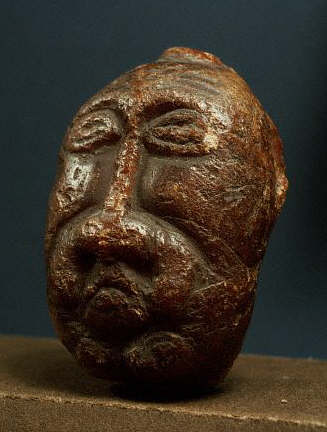 A viking sculpture of a head carved from amber